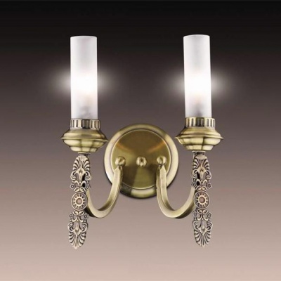 Светильник Odeon Light 1966/2W бронза Lacura Светильник Odeon Light 1966/2W бронза LacuraРустика<br>Особенный стиль рустика искусно воссоздан в настенном бра Odeon Light 1966/2W. Это выбор в пользу исключительности освещения. Оцените дизайн бра Odeon Light 1966/2W, где стилизованный силуэт белоснежных плафонов в виде свечей закреплён на бронзовом изгибе лаконичной конструкции. Ещё к тому же нижняя часть светильника дополнена изысканной деталью с особым романским узором. В итоге бра Odeon Light 1966/1W не только позволит выделить отдельные зоны томления на просторах домашнего очага, но и станет неподражаемым элементом декора в дизайне интерьера. Это рустика, которая царит в мире изящной оригинальности. Вас не оставит равнодушным ни свет, ни эстетика, ни стилистика представленного бра.<br><br>S освещ. до, м2: 5<br>Тип товара: Светильник настенный бра<br>Тип лампы: галогенная / LED-светодиодная<br>Тип цоколя: G9<br>Количество ламп: 2<br>Ширина, мм: 260<br>MAX мощность ламп, Вт: 40<br>Высота, мм: 330<br>Цвет арматуры: бронзовый