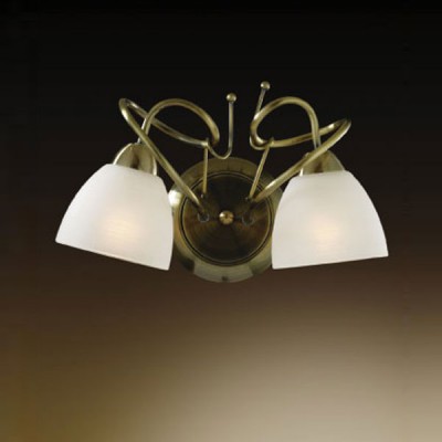 Светильник Odeon Light 2120/2W Kaena бронза Светильник Odeon Light 2120/2W Kaena бронзаКлассика<br>Светильник с двумя плафонами, направленными в разные стороны, идеально подойдет к интерьеру, если вы планируете осветить две соседние зоны, но не хотите загромождать пространство несколькими осветительными приборами. Несмотря на то, что его размеры относительно небольшие, в нем совмещаются одновременно несколько стилей – от классики(сочетание бронзового и белого цветов) и романтизма(«завитки» и форма плафона в виде цветка) до хай-тека(соединение металла и стекла).<br><br>S освещ. до, м2: 8<br>Тип товара: Светильник настенный бра<br>Скидка, %: 20<br>Тип лампы: накаливания / энергосбережения / LED-светодиодная<br>Тип цоколя: E14<br>Количество ламп: 2<br>Ширина, мм: 315<br>MAX мощность ламп, Вт: 60<br>Высота, мм: 200<br>Цвет арматуры: бронзовый