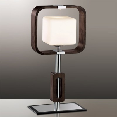 Светильник настольный Odeon light 2199/1T хром Via Светильник настольный Odeon light 2199/1T хром ViaДеревянные и ротанг<br>Перед Вами творение не простого дизайнера, а архитектора, ведь настольная лампа Odeon light 2199/1T выполнена в исключительной манере. Такое ощущение, будто на Вашем столе награда за ранние поиски чего-то очень оригинального, не выходящего за рамки утончённого вкуса. Геометрия лампы Odeon light 2199/1T лаконична, но непревзойдённа. Это великолепная работа с формами кубов, которые пронизывают всю хромированную конструкцию светильника. Однако перед Вами не острые черты геометрических образов, а смягчённые детали, что придаст интерьеру особый шарм. Настольная лампа Odeon light 2199/1T – награда, которая будет вызывать восторг каждого гостя в Вашем уютном доме.<br><br>S освещ. до, м2: 4<br>Тип лампы: накаливания / энергосбережения / LED-светодиодная<br>Тип цоколя: E27<br>Количество ламп: 1<br>MAX мощность ламп, Вт: 60<br>Диаметр, мм мм: 280<br>Высота, мм: 495<br>Цвет арматуры: серебристый