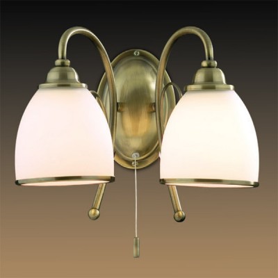 Светильник Odeon Light 2242/2W бронза Mida Светильник Odeon Light 2242/2W бронза MidaКлассика<br><br><br>S освещ. до, м2: 8<br>Тип товара: Светильник настенный бра<br>Тип лампы: накаливания / энергосбережения / LED-светодиодная<br>Тип цоколя: E27<br>Количество ламп: 2<br>Ширина, мм: 350<br>MAX мощность ламп, Вт: 60<br>Высота, мм: 240<br>Цвет арматуры: бронзовый