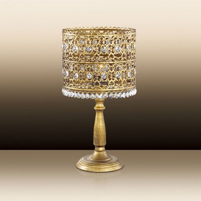 Светильник настольный Odeon light 2641/1T Светильник настольный Odeon light 2641/1TТиффани<br>Декоративная настольная лампа Odeon light 2641/1T представлена итальянскими мастерами в поистине роскошном обличии богатого убранства. Оцените по достоинству художественную резку по металлу бронзового мерцания, из которого составлена узорчатая конструкция столь грациозного шедевра. Композиция представляет собой единение каждой части изделия: перед Вами стилизованный «шатёр» насыщенного света для настольных и других поверхностей, украшенный переливающимися каменьями в форме крупных гранул и аккуратных капель. Это настоящее сокровище для Вашего интерьера, отдельный элемент благородной роскоши в восточном обрамлении, отвечающем за необходимые лоск и престиж дома.<br><br>S освещ. до, м2: 3<br>Тип цоколя: E14<br>Количество ламп: 1<br>Ширина, мм: 210<br>MAX мощность ламп, Вт: 40<br>Высота, мм: 405<br>Цвет арматуры: бронзовый