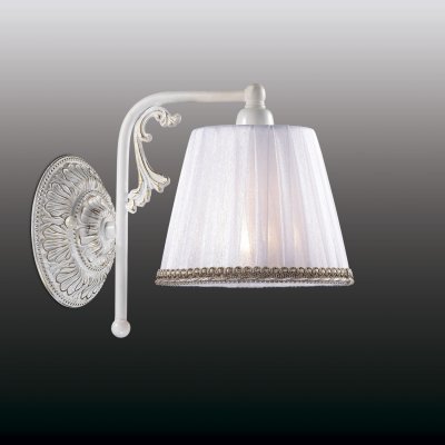 Настенный светильник odeon light 2697/1W VEADO Настенный светильник odeon light 2697/1W VEADOМодерн<br>Оригинальный стиль рустика воплощен в настенном бра odeon light 2697/1W. Спешим заверить, что перед Вами изделие высшего итальянского качества. Также стоит отметить, что оно выполнено в лучших традициях европейской моды: изысканной и безупречной. В изделии прекрасно всё: начиная с цветового исполнения, заканчивая дизайном. Сочетание чистого белоснежного оттенка и золотистых вкраплений делает настенное бра odeon light 2697/1W поистине благородным. Текстильный плафон состоит из плотного и прозрачного материалов, гармонично дополняющих друг друга. Нет ни единого лишнего элемента! Всё очень стильно и лаконично! Так в едином творении воплощены итальянская грация, безупречный вкус и модные тенденции, исполненные в формате рустика.<br><br>S освещ. до, м2: 4<br>Тип лампы: накаливания / энергосбережения / LED-светодиодная<br>Тип цоколя: E14<br>Количество ламп: 1<br>Ширина, мм: 150<br>MAX мощность ламп, Вт: 60<br>Расстояние от стены, мм: 220<br>Высота, мм: 240<br>Цвет арматуры: белый с золотистой патиной