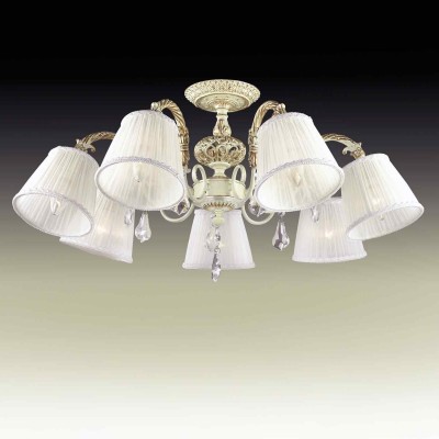 Люстра потолочная Odeon light 2882/7c NAVIS Люстра потолочная Odeon light 2882/7c NAVISПотолочные<br>В данном разделе интернет-магазина Светодом Вы сможете купить для освещения дома грациозную модель - Люстра 2882/7C серии Navis выполнена в классическом стиле. Потолочная люстра изготовлена из металла с кремовым покрытием и золотой патиной. Классичесский дизайн данной модели прекрасно подойдет к любому интерьеру и станет его незаменимым дополнением, плафоны выполнены из ткани, декорирована люстра хрустальными подвесками . Цоколь Е14. Мощность 7х40W. Нет ламп в комплекте.<br><br>Установка на натяжной потолок: Да<br>S освещ. до, м2: 14<br>Крепление: Планка<br>Тип лампы: Накаливания / энергосбережения / светодиодная<br>Тип цоколя: E14<br>Количество ламп: 7<br>MAX мощность ламп, Вт: 40<br>Диаметр, мм мм: 780<br>Высота, мм: 370<br>Оттенок (цвет): кремовый с золотой патиной<br>Цвет арматуры: бежевый с золотистой патиной