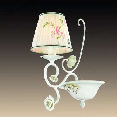 Светильник настенный бра Odeon light 2886/1W MONTALA Светильник настенный бра Odeon light 2886/1W MONTALAФлористика<br>В данном разделе интернет-магазина Светодом Вы сможете купить для освещения дома грациозную модель - Бра 2886/1W серии Montala выполнена в классическом стиле. Бра имееи белоснежный цвет базы, нежные декоративные керамические розы в сочитании с неповторимо нежным рисунком на тканевом абажуре. Цоколь Е14. Мощность 1х60W. Нет ламп в комплекте.<br><br>Тип товара: Светильник настенный бра<br>Тип лампы: Накаливания / энергосбережения / светодиодная<br>Тип цоколя: E14<br>Количество ламп: 1<br>Ширина, мм: 200<br>MAX мощность ламп, Вт: 60<br>Расстояние от стены, мм: 270<br>Высота, мм: 360<br>Оттенок (цвет): белый<br>Цвет арматуры: белый с золотистой патиной