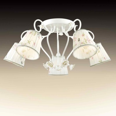 Люстра потолочная Odeon light 2886/5c MONTALA Люстра потолочная Odeon light 2886/5c MONTALAПотолочные<br>В данном разделе интернет-магазина Светодом Вы сможете купить для освещения дома грациозную модель - Люстра 2886/5С серии Montala выполнена в классическом стиле. Потолочная люстра имеет белоснежный цвет базы, нежные декоративные керамические розы в сочитании с неповторимо нежным рисунком на тканевом абажуре. Цоколь Е14. Мощность 5х60W. Нет ламп в комплекте.<br><br>Установка на натяжной потолок: Да<br>S освещ. до, м2: 15<br>Крепление: Планка<br>Тип лампы: Накаливания / энергосбережения / светодиодная<br>Тип цоколя: E14<br>Цвет арматуры: белый с золотистой патиной<br>Количество ламп: 5<br>Диаметр, мм мм: 690<br>Высота, мм: 300<br>Оттенок (цвет): белый<br>MAX мощность ламп, Вт: 60