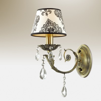 Светильник настенный бра Odeon light 2932/1W TETRO Светильник настенный бра Odeon light 2932/1W TETROКлассические<br>В данном разделе интернет-магазина Светодом Вы сможете купить для освещения дома грациозную модель - Бра 2932/1W серии Tetro выполнена в цвете бронза. Светлый тканевый абажур украшен ажурным орнаментом черного цвета, дополняют бра декоративные хрустальные подвески. Цоколь Е14. Мощность 1х40W. Нет ламп в комплекте.<br><br>Тип лампы: Накаливания / энергосбережения / светодиодная<br>Тип цоколя: E14<br>Количество ламп: 1<br>Ширина, мм: 150<br>MAX мощность ламп, Вт: 40<br>Высота, мм: 300<br>Оттенок (цвет): бронзовый