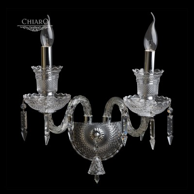 Светильник настенный бра Chiaro 313022602 Барселона Светильник настенный бра Chiaro 313022602 БарселонаХрустальные<br>Описание модели 313022602: Роскошная люстра из коллекции «Барселона» поражает воображение своим торжественным величием в сочетании с королевским изяществом. Основание из металла цвета хрома декорировано прозрачным хрустальным стеклом грановитой огранки. Розетки светильника и его центральная ось выполнены в традиционном классическом стиле. С ними великолепно гармонируют плавные витые рожки. Но настоящий шик светильнику придают декоративные подвески из хрусталя трех видов оригинальной огранки и изящные колокольчики из хрустального стекла. Всё это сияющее великолепие наполнит помещение ослепительным блеском. Подобная продуманная до мельчайших деталей филигранная работа превращает люстру в маленькое произведение искусства. Она идеально подойдет для изысканно оформленных комнат с высокими потолками. Рекомендуемая площадь освещения порядка 36 кв.м.<br><br>S освещ. до, м2: 4<br>Тип лампы: накал-я - энергосбер-я<br>Тип цоколя: E14<br>Количество ламп: 2<br>Ширина, мм: 210<br>MAX мощность ламп, Вт: 40<br>Длина, мм: 360<br>Высота, мм: 380<br>Цвет арматуры: серебристый