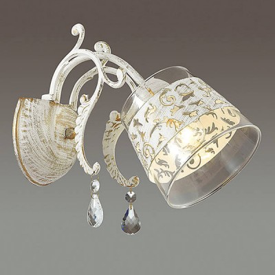 Светильник Lumion 3305/1W Светильник Lumion 3305/1WКлассические<br>Элегантная серия Delfina в белом исполнении с золотой патиной и ажурным декором на стеклянном плафоне. Функциональная и изящная серия станет изюминкой вашего интерьера.<br><br>Крепление: Настенное<br>Тип лампы: Накаливания / энергосбережения / светодиодная<br>Тип цоколя: E14<br>Количество ламп: 1<br>Ширина, мм: 230<br>Расстояние от стены, мм: 290<br>Высота, мм: 250<br>MAX мощность ламп, Вт: 40