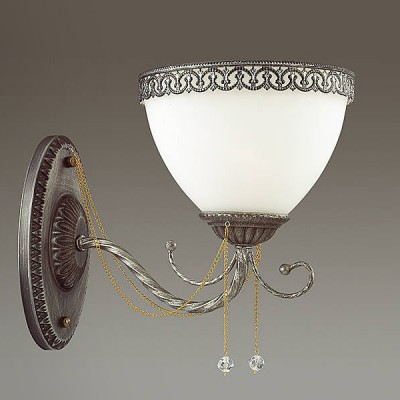 Светильник Lumion 3428/1W Светильник Lumion 3428/1WКлассические<br>Нежная, утонченная и грациозная модель Berza - воплощение очарования классики. Изящное основание в цвете бронза, плафоны из белого матового стекла с металлическим резным декором, цепочки с бусинами - все эти элементо прекрасно сочетаются и идеально дполняют друг друга.<br><br>Крепление: Настенное<br>Тип лампы: Накаливания / энергосбережения / светодиодная<br>Тип цоколя: E14<br>Количество ламп: 1<br>Ширина, мм: 160<br>MAX мощность ламп, Вт: 40<br>Расстояние от стены, мм: 265<br>Высота, мм: 215
