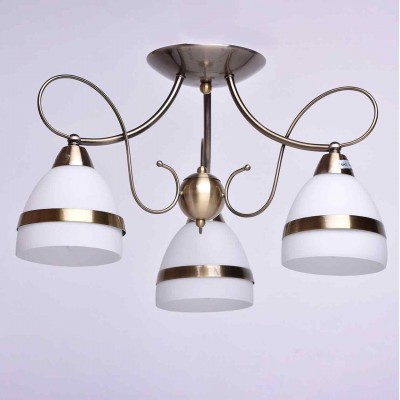 Люстра De markt 347017903 Фелиция Люстра De markt 347017903 ФелицияПотолочные<br>Описание модели 347017903: Изящная люстра из коллекции «Фелиция» освежит обстановку комнаты. Её металлическое основание выполнено в двух цветовых вариациях: цвета матированной античной бронзы и глянцевого оттенка хрома. В тон основанию декор матово-белых плафонов, выполненный в форме металлических колец. Помимо этого люстра декорирована витыми элементами из металла. Площадь освещения порядка 10 кв.м.<br><br>Установка на натяжной потолок: Да<br>S освещ. до, м2: 6<br>Крепление: Планка<br>Тип лампы: Накаливания / энергосбережения / светодиодная<br>Тип цоколя: E14<br>Количество ламп: 3<br>MAX мощность ламп, Вт: 40<br>Диаметр, мм мм: 500<br>Высота, мм: 300<br>Цвет арматуры: бронзовый