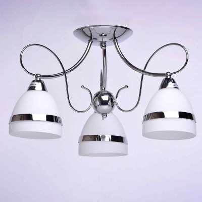 Люстра De markt 347018003 Фелиция Люстра De markt 347018003 ФелицияПотолочные<br>Описание модели 347018003: Изящная люстра из коллекции «Фелиция» освежит обстановку комнаты. Её металлическое основание выполнено в двух цветовых вариациях: цвета матированной античной бронзы и глянцевого оттенка хрома. В тон основанию декор матово-белых плафонов, выполненный в форме металлических колец. Помимо этого люстра декорирована витыми элементами из металла. Площадь освещения порядка 10 кв.м.<br><br>Установка на натяжной потолок: Да<br>S освещ. до, м2: 6<br>Крепление: Планка<br>Тип лампы: Накаливания / энергосбережения / светодиодная<br>Тип цоколя: E14<br>Количество ламп: 3<br>MAX мощность ламп, Вт: 40<br>Диаметр, мм мм: 500<br>Высота, мм: 300<br>Цвет арматуры: серебристый