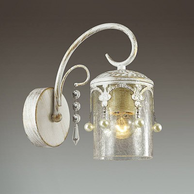 Светильник Lumion 3481/1W Светильник Lumion 3481/1WКлассические<br>Элегантная, легкая серия Tibo в белом цвете с золотой патиной будет смотреться изящно и стильно в любом интерьере. Металлические декоры в готическом стиле в сочетании с толстым стеклом создают атмосферу легкости и торжественности.<br><br>Крепление: Настенное<br>Тип лампы: Накаливания / энергосбережения / светодиодная<br>Тип цоколя: E14<br>Количество ламп: 1<br>Ширина, мм: 110<br>Расстояние от стены, мм: 210<br>Высота, мм: 225<br>MAX мощность ламп, Вт: 60