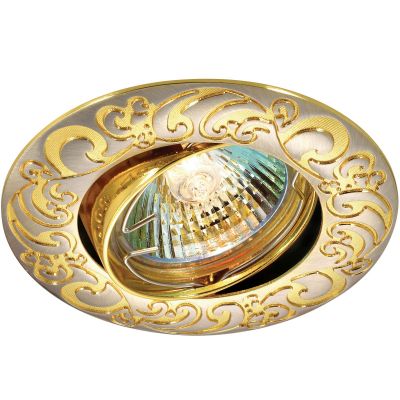 Novotech HENNA 369690 Точечный встраиваемый светильник Novotech HENNA 369690 Точечный встраиваемый светильникКруглые<br>Стандартный встраиваемый поворотный светильник модели Novotech 369690 из серии HENNA отличается следующим качеством: Светильник сделан из алюминиевого литья. Это сплав, основными достоинствами которого являются — устойчивость к практически всем видам негативного воздействия окружающей среды, коррозии, небольшой вес, по сравнению с другими видами металла и экологическая безопасность материала. Простота монтажа. Экономичность. Надёжность. Большой срок службы. Возможность реализации оригинальных дизайнерских решений за счет гибкости и небольшой толщины. !!!Предупреждение: Ленту запрещается резать, чтобы не нарушать герметичность конструкции. В комплект не входит элемент питания.<br><br>S освещ. до, м2: 2<br>Тип лампы: галогенная<br>Тип цоколя: GU5.3 (MR16)<br>MAX мощность ламп, Вт: 50<br>Диаметр, мм мм: 92<br>Диаметр врезного отверстия, мм: 82<br>Расстояние от стены, мм: 5<br>Высота, мм: 25<br>Оттенок (цвет): золото<br>Цвет арматуры: серебристый