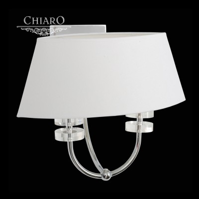 Светильник настенный бра Chiaro 386021302 Палермо Светильник настенный бра Chiaro 386021302 ПалермоМодерн<br>Описание модели 386021302: Новаторский дизайн светильника из коллекции Палермо состоит из сочетания броской металлической арматуры цвета хрома и текстильного абажура оригинальной формы. Хромированное основание декорировано чашами из литого гранёного хрусталя. Светильник из коллекции Палермо интересен крупными деталями в классической монохромной цветовой гамме.<br><br>S освещ. до, м2: 4<br>Тип товара: Светильник настенный бра<br>Тип лампы: накаливания / энергосбережения / LED-светодиодная<br>Тип цоколя: E14<br>Количество ламп: 2<br>Ширина, мм: 390<br>MAX мощность ламп, Вт: 40<br>Длина, мм: 260<br>Высота, мм: 330<br>Поверхность арматуры: глянцевый<br>Цвет арматуры: серебристый<br>Общая мощность, Вт: 80