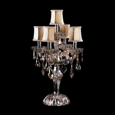 Lightstar NATIVO 715957 Настольная лампа Lightstar NATIVO 715957 Настольная лампаХрустальные<br>Настольная лампа – это не просто источник дополнительного освещения, но и оригинальный элемент декора. Его можно установить в спальне, гостиной, кабинете и других комнатах. Интернет-магазин «Светодом» предлагает настольные лампы разных стилей по доступным ценам. Благодаря большому ассортименту Вы обязательно найдете в нашем каталоге именно ту модель, которую искали. Настольная лампа Lightstar 715957 – прекрасный вариант для завершения интерьера. Ее можно включить одновременно с люстрой для более яркого освещения или без нее для создания уютной атмосферы, настраивающей на отдых. Купить настольную лампу Lightstar 715957 Вы можете с помощью виртуальной «Корзины» или по контактным номерам, указанным на сайте.<br><br>S освещ. до, м2: 13<br>Тип лампы: накал-я - энергосбер-я<br>Тип цоколя: E14<br>Количество ламп: 5<br>MAX мощность ламп, Вт: 40<br>Диаметр, мм мм: 400<br>Размеры: D 670 H 400<br>Высота, мм: 670<br>Цвет арматуры: серебристый