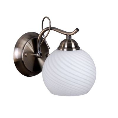 Светильник бра Colosseo 71903/1W Светильник бра Colosseo 71903/1WСовременные<br>Настенный светильник Colosseo 71903/1W предназначен для ценителей оригинальных и стильных оформлений интерьера. Плавные линии арматуры повторяются в рисунке плафона, элегантно сочетаются между собой оттенки бронзы и белого матового цветов, создавая безупречный образ, который великолепно впишется в любую комнату – от спальни до детской. Лучше всего настенные бра смотрятся в комплекте из нескольких экземпляров и люстрой той же серии, придавая интерьеру законченный и профессиональный вид. Рекомендуем Вам в цветовой палитре комнаты использовать похожие оттенки, например, в шторах, мебели, покрывалах и два-три контрастных цвета для акцента на аксессуарах – красную вазу, желтые диванные подушки и т.п.<br><br>S освещ. до, м2: 4<br>Крепление: настенное<br>Тип лампы: накаливания / энергосбережения / LED-светодиодная<br>Тип цоколя: E27<br>Количество ламп: 1<br>Ширина, мм: 130<br>MAX мощность ламп, Вт: 60<br>Расстояние от стены, мм: 220<br>Высота, мм: 180<br>Цвет арматуры: бронзовый
