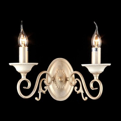 Светильник Maytoni ARM337-02-R Elegant 47 Светильник Maytoni ARM337-02-R Elegant 47Современные<br>Извивающиеся формы рожков бра Maytoni ARM337-02-R от немецкой компании Майтони превращают его из простого светотехнического прибора в настоящий интерьерный аксессуар, который может быть куплен для оформления абсолютно любой комнаты. Такой универсальности способствует светлый цвет «кремового золота» арматуры, а также два классических плафона в виде свечек на ветру. Данное бра от фирмы Maytoni может быть закреплено на вертикальной поверхности стены при помощи монтажной пластины, которая отличается наличием в ее центре рельефного рисунка. Изучив фото прибора и его цену, вы сможете сразу же оформить его заказ. Помимо этого, вам нужно будет дополнительно позаботиться о приобретении двух лампочек, которые не были включены в заявленную на сайте стоимость комплекта.<br><br>S освещ. до, м2: 8<br>Крепление: монтажная пластина<br>Тип лампы: накаливания / энергосбережения / LED-светодиодная<br>Тип цоколя: E14<br>Количество ламп: 2<br>Ширина, мм: 340<br>MAX мощность ламп, Вт: 60<br>Высота, мм: 190<br>Цвет арматуры: золотой