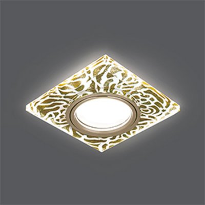 Светильник Gauss Backlight BL063 Квадрат. Золотой узор/Золото, Gu5.3, LED 2700K Светильник Gauss Backlight BL063 Квадрат. Золотой узор/Золото, Gu5.3, LED 2700KКвадратные<br>Встраиваемые светильники – популярное осветительное оборудование, которое можно использовать в качестве основного источника или в дополнение к люстре. Они позволяют создать нужную атмосферу атмосферу и привнести в интерьер уют и комфорт. Интернет-магазин «Светодом» предлагает стильный встраиваемый светильник Gauss Backlight BL063. Данная модель достаточно универсальна, поэтому подойдет практически под любой интерьер. Перед покупкой не забудьте ознакомиться с техническими параметрами, чтобы узнать тип цоколя, площадь освещения и другие важные характеристики. Приобрести встраиваемый светильник Gauss Backlight BL063 в нашем онлайн-магазине Вы можете либо с помощью «Корзины», либо по контактным номерам. Мы развозим заказы по Москве, Екатеринбургу и остальным российским городам.<br><br>S освещ. до, м2: 3<br>Тип лампы: галогенная/LED<br>Тип цоколя: GU5.3 (MR16)<br>Количество ламп: 1<br>Ширина, мм: 90<br>MAX мощность ламп, Вт: 50<br>Диаметр врезного отверстия, мм: 65<br>Длина, мм: 90<br>Высота, мм: 25<br>Цвет арматуры: Золотой