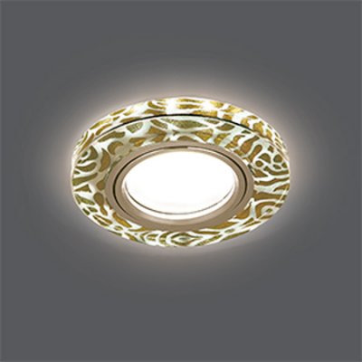 Светильник Gauss Backlight BL064 Кругл. Золотой узор/Золото, Gu5.3, LED 2700K Светильник Gauss Backlight BL064 Кругл. Золотой узор/Золото, Gu5.3, LED 2700KКруглые<br>Встраиваемые светильники – популярное осветительное оборудование, которое можно использовать в качестве основного источника или в дополнение к люстре. Они позволяют создать нужную атмосферу атмосферу и привнести в интерьер уют и комфорт. Интернет-магазин «Светодом» предлагает стильный встраиваемый светильник Gauss Backlight BL064. Данная модель достаточно универсальна, поэтому подойдет практически под любой интерьер. Перед покупкой не забудьте ознакомиться с техническими параметрами, чтобы узнать тип цоколя, площадь освещения и другие важные характеристики. Приобрести встраиваемый светильник Gauss Backlight BL064 в нашем онлайн-магазине Вы можете либо с помощью «Корзины», либо по контактным номерам. Мы развозим заказы по Москве, Екатеринбургу и остальным российским городам.<br><br>S освещ. до, м2: 3<br>Тип лампы: галогенная/LED<br>Тип цоколя: GU5.3 (MR16)<br>Количество ламп: 1<br>MAX мощность ламп, Вт: 50<br>Диаметр, мм мм: 90<br>Диаметр врезного отверстия, мм: 65<br>Высота, мм: 25<br>Цвет арматуры: Золотой