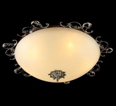 Люстра Maytoni CL900-05-R Geometry 1 Люстра Maytoni CL900-05-R Geometry 1Потолочные<br>Если вы не можете подобрать настенно-потолочную люстру, то рекомендуем вам обратить внимание на изделие от компании Maytoni. Посмотрев на представленное фото, вы увидите светильник круглой формы кремового цвета. Этот осветительный прибор имеет пять лампочек, которые необходимо будет<br><br>Установка на натяжной потолок: Ограничено<br>S освещ. до, м2: 13<br>Крепление: Планка<br>Тип лампы: накаливания / энергосбережения / LED-светодиодная<br>Тип цоколя: E14<br>Количество ламп: 5<br>MAX мощность ламп, Вт: 40<br>Диаметр, мм мм: 640<br>Высота, мм: 200<br>Цвет арматуры: бронзовый