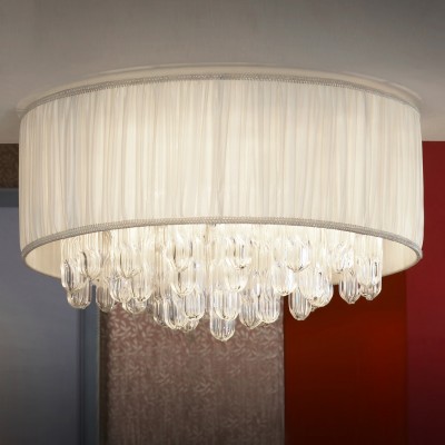 Люстра белая Lussole Lsc-9507-07 Люстра белая Lussole Lsc-9507-07Потолочные<br>Кремовый оттенок потолочной люстры Lussole Lsc-9507-07 делает её особенно привлекательной и манящей взор. К этому добавлено гармоничное сочетание различных материалов. На металлических кольцах закреплен изысканный текстиль, который обрамляет стеклянные детали в форме кристаллов. Потолочная люстра Lussole Lsc-9507-07 выглядит, с одной стороны, роскошно, с другой, деликатно. Это и есть мода в формате модерн. Такое изделие можно повесить в зале, гостиной, спальне и даже обеденной зоне. Всё зависит от Ваших предпочтений. Не упустите возможность украсить свой интерьер аккуратной и стильной люстрой Lussole Lsc-9507-07 в исключительно модном формате модерн. Тем более, когда изделие представлено в нежном кремовом оттенке.<br><br>Установка на натяжной потолок: Ограничено<br>S освещ. до, м2: 14<br>Крепление: Планка<br>Тип лампы: накаливания / энергосбережения / LED-светодиодная<br>Тип цоколя: e14<br>Количество ламп: 7<br>MAX мощность ламп, Вт: 40<br>Диаметр, мм мм: 550мм<br>Высота, мм: 300мм<br>Оттенок (цвет): бежевый<br>Цвет арматуры: серебристый
