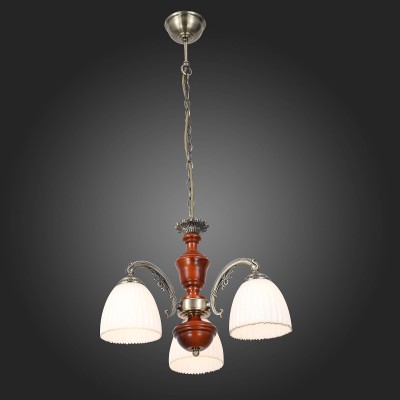 Светильник St luce SL151.303.03 Светильник St luce SL151.303.03Подвесные<br>Классическая форма светильников Fiore гармонично передаёт традиции и вкусы классических канонов. Светильники подходят для освещения и оформления интерьера гостиных, спален, столовых в классическом стиле или стиле Гранж. Металлическое основание цвета бронзы,со вставками из светло-коричневого дерева. Стеклянные плафоны по краю вручную расписаны золотым узором.<br><br>Установка на натяжной потолок: Да<br>S освещ. до, м2: 6<br>Крепление: Крюк<br>Тип лампы: накаливания / энергосбережения / LED-светодиодная<br>Тип цоколя: E27<br>Количество ламп: 3<br>MAX мощность ламп, Вт: 40<br>Диаметр, мм мм: 560<br>Высота, мм: 420 - 1200<br>Поверхность арматуры: матовая<br>Цвет арматуры: коричневый