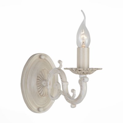 Светильник St Luce SL161.701.01 Светильник St Luce SL161.701.01Классические<br>Если Вы настроены купить светильник модели SL16170101, то обратите внимание: Коллекция светильников Genere - это торжество и роскошь античных мотивов в современном интерьере. Металлическое основание этих люстр уже само по себе является произведением искусства. Резные детали, элегантные завитки, массивные подсвечники - все эти элементы выглядят празднично и эффектно. А покрытие металла основания матовой краской цвета слоновой кости добавляет эстетичности и торжественности самому светильнику и интерьеру зала, кабинета, холла, которые он украсит.<br><br>Тип лампы: Накаливания / энергосбережения / светодиодная<br>Тип цоколя: E14<br>Количество ламп: 1<br>Ширина, мм: 110<br>MAX мощность ламп, Вт: 40<br>Высота, мм: 260
