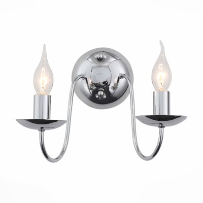 Светильник St luce SL171.101.02 Светильник St luce SL171.101.02Современные<br>Если Вы настроены купить светильник модели SL17110102, то обратите внимание: Коллекция светильников Medusa - это сочетание античной классики с современным дизайном. Тонкие и элегантные линии металлического основания выглядят изящно, но при этом надёжно. Покрытие деталей люстры в цвет хрома - дань сегодняшней моде и намёк на индустриальность модели. Плафоны выполнены в виде свечей, которые стоят на широких металлических подсвечниках. Световой поток отражается в их блеске, создавая мягкие блики на потолке и горизонтальных поверхностях помещения. Разнообразие светильников из коллекции Medusa позволяет создать тёплую, и в то же время ,стильную обстановку.<br><br>Тип лампы: Накаливания / энергосбережения / светодиодная<br>Тип цоколя: E14<br>Количество ламп: 2<br>Ширина, мм: 190<br>MAX мощность ламп, Вт: 40<br>Расстояние от стены, мм: 270<br>Высота, мм: 180