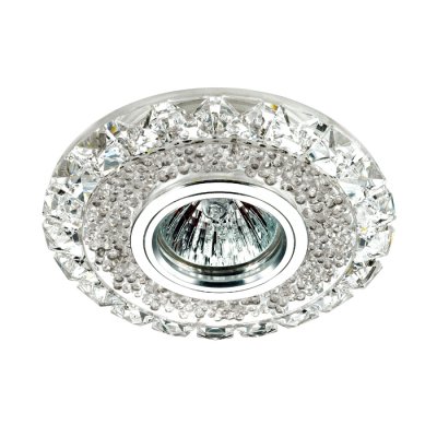 Novotech RIVA 357307 Светильник встраиваемый Novotech RIVA 357307 Светильник встраиваемыйХрустальные<br>Встраиваемый светильник со светодиодной подсветкой и встроенным драйвером модели Novotech 357307 из серии RIVA отличается следующим качеством: Декоративное украшение произведено из хрусталя. Хрусталь обладает высоким показателем плотности, прозрачности и блеска. Благодаря содержанию свинца (не менее 30%). Хрусталь обладает высоким показателем плотности, прозрачности и блеска. Благодаря содержанию свинца (не менее 30%) и определённому подбору углов, образуемых гранями, изделия из хрусталя отличаются необыкновенно яркой, многоцветной игрой света, чарующей магией красоты, совершенства и роскоши. Имееется возможность раздельного включения LED и лампы, при использовании двухклавишного выключателя света.<br><br>Тип лампы: галогенная/LED<br>Тип цоколя: GX5.3<br>MAX мощность ламп, Вт: 50<br>Диаметр, мм мм: 120<br>Высота, мм: 60<br>Цвет арматуры: серебристый