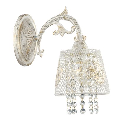 Светильник бра Odeon light 3212/1W PEPPI Светильник бра Odeon light 3212/1W PEPPIКлассика<br>Отличный вариант домашнего освещения Odeon light Бра 3212/1W серии PEPPI оформлена в классическом стиле. Светильник состоит из металлического сетчатого абажура с нежным декором, украшенного хрустальными подвесками, и традиционной арматуры белого с золотой патиной цвета с хрустальными элементами декора. Данная модель несомненно станет той деталью интерьера, которая сделает его неотразимым. Цоколь E27. Мощность 1*60W. Нет ламп в комплекте.<br><br>Тип цоколя: E27<br>Количество ламп: 1<br>Ширина, мм: 265<br>MAX мощность ламп, Вт: 60<br>Длина, мм: 110<br>Высота, мм: 183<br>Цвет арматуры: белый с золотистой патиной